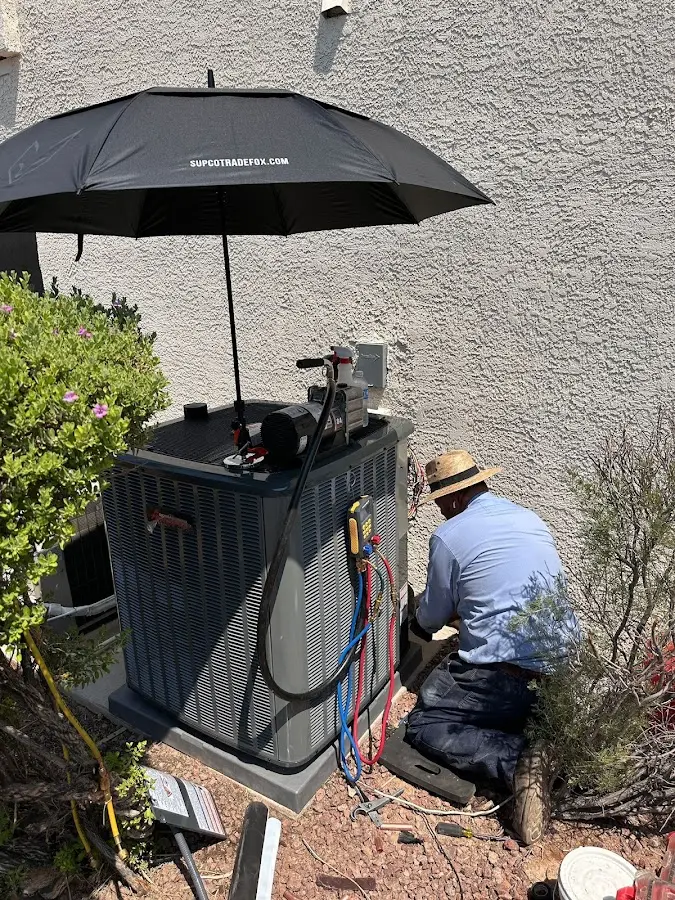 HVAC technician performing outdoor AC maintenance in Pulaski